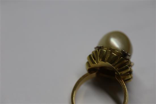 An 18ct gold, diamond and cultured pearl dress ring by John Donald, circa 1970, in modernist setting, size P/Q.